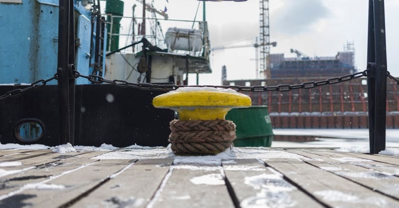 Anvil - Yellow Anvil Beside Green Boat