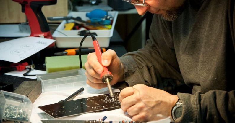 Soldering - Man Soldering Circuit Board