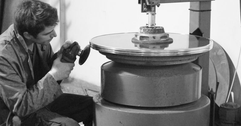 Polishing - Man Sanding on Metal Surface in Grayscale Photography