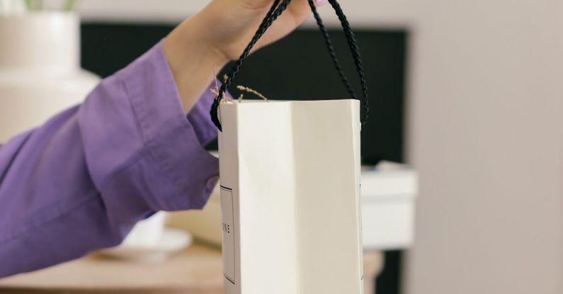 Handling - Hands Handling Paper Gift Bag