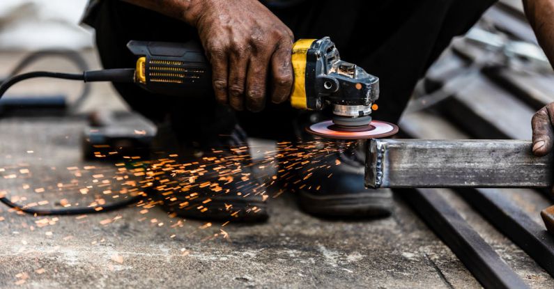 Ironwork - Man Using an Angle Grinder