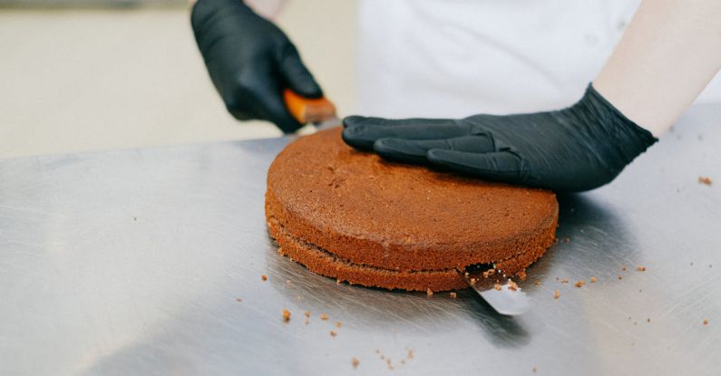 Knife Making - Person Slicing a Cake