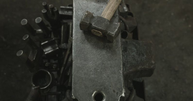 Anvil - Blacksmith`s Workplace with Hammer and Anvil