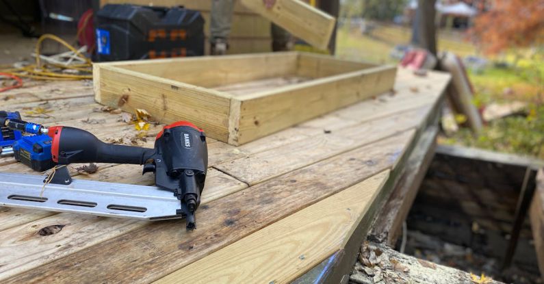 Tool Restoration - Pneumatic Nail Gun on the Boards of the Terrace Under Construction