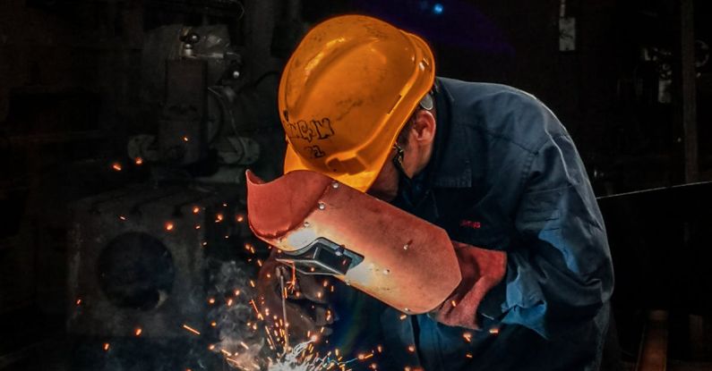 Metalwork - Man Welding on Gray Metal Sheet