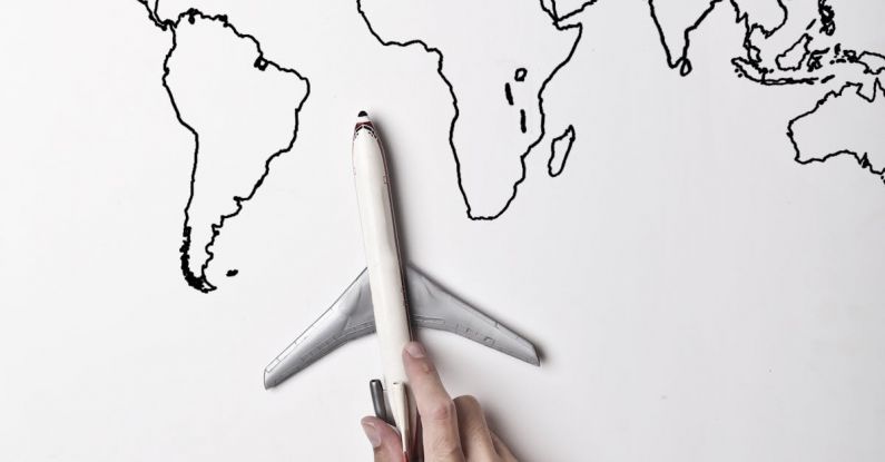 Knife Blade - Crop person in vibrant yellow clothes holding little gray plane against contour map on white wall as concept of tourism and adventure